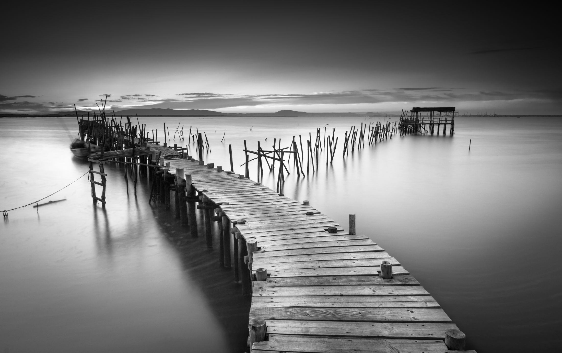 A calm, still lake at dawn evoking the peace of therapy at Clarity Wellbeing Clinic Nuneaton