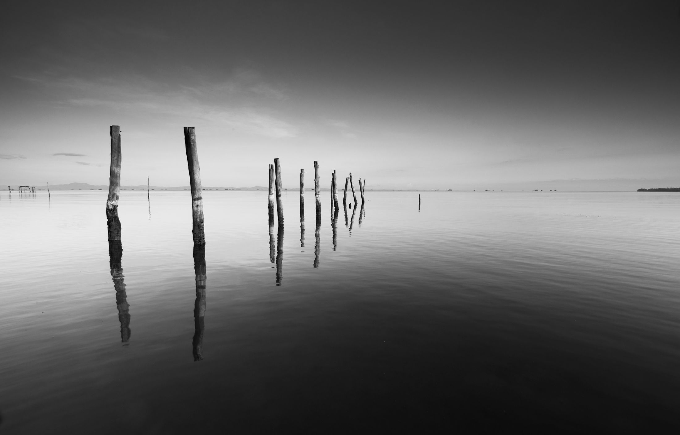 A still wooden pier over calm water, evoking the range of therapy at Clarity Wellbeing Clinic Nuneaton